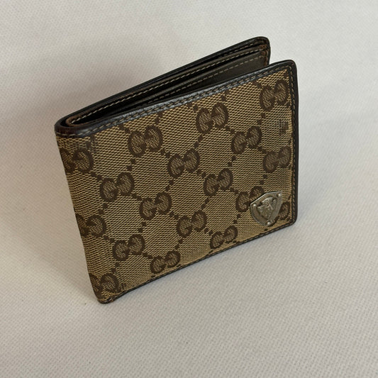 gucci monogram bi-fold wallet with metal patch